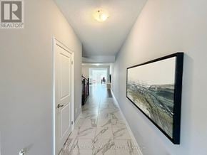 Markham (Cedarwood) apartment for rent - A hallway with a marble floor and a painting on the wall.
