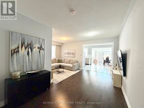 Markham (Cedarwood) apartment for rent - A living room with a couch, a coffee table, and a painting on the wall.