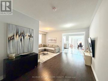 Markham (Cedarwood) apartment for rent - A living room with a couch, a coffee table, and a painting on the wall.