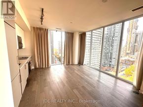 Toronto (Church-Yonge Corridor) condo for rent - A spacious kitchen and living room with a view of the city.