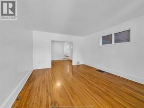 Windsor duplex for rent - A room with wooden flooring and white walls.