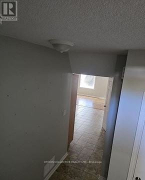 Barrie (Edgehill Drive) apartment for rent - A room with a white ceiling and a doorway leading to another room.