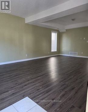 Barrie (Edgehill Drive) apartment for rent - A room with wooden flooring and a window.