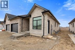 Amherstburg apartment for rent - A house under construction with a clear blue sky.