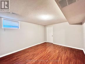 Toronto (Centennial Scarborough) apartment for rent - A room with wooden flooring and a window with blinds.