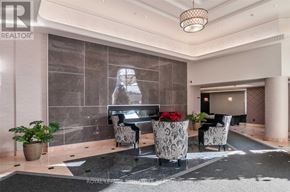 Richmond Hill (Beaver Creek Business Park) condo for rent - A modern living room with a black and white color scheme.