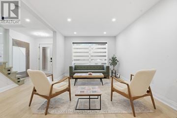 Hamilton (Gilkson) apartment for rent - A living room with a sofa, two chairs and a coffee table.