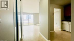 Kitchener condo for rent - A realtor sign is on the door of a room.