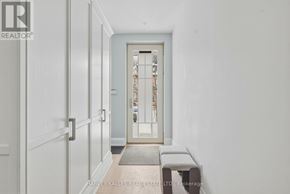 Toronto (Annex) apartment for rent - A hallway with a door and a bench.