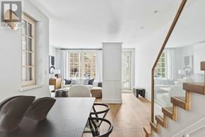 Toronto (Annex) apartment for rent - A modern living room with a black table and chairs.