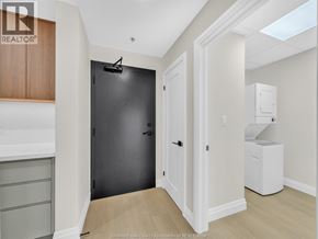 Windsor apartment for rent - A black door is in a white hallway.