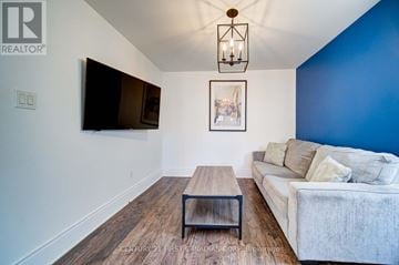 London East (East G) duplex for rent - A living room with a white couch and a wooden coffee table.