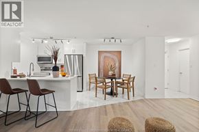 Windsor condo for rent - A modern kitchen with a dining table set up.