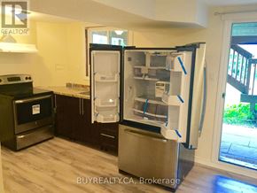 Aurora (Aurora Grove) apartment for rent - A refrigerator with its door open in a kitchen.