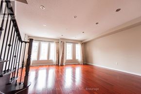 Markham (Berczy) townhouse for rent - A room with wooden floors and white curtains.