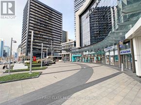 Toronto (Willowdale East) condo for rent - A city street with a First Class Realty Inc. sign in Brokerage.