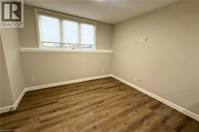 Woodstock apartment for rent - A room with wooden flooring and a window.