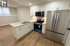 Woodstock apartment for rent - A kitchen with a stove, refrigerator, and cabinets.