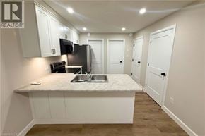 Woodstock apartment for rent - A kitchen with a sink, microwave, and oven.