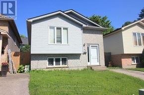 London North (North I) apartment for rent - A house with a grey siding and a white door is for sale.