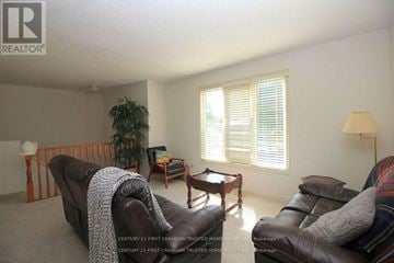 London North (North I) apartment for rent - A living room with a brown leather couch and a wooden coffee table.