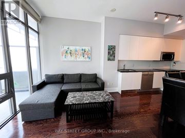 Toronto (Church-Yonge Corridor) condo for rent - A living room with a grey couch and a coffee table.