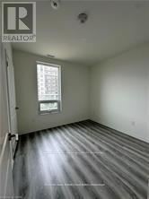 Guelph (Willow West/Sugarbush/West Acres) condo for rent - A room with a window and a wooden floor.
