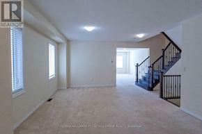 Essa (Angus) apartment for rent - A spacious room with a staircase and a window.