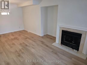 Oakville (Cv Clearview) apartment for rent - A room with a fireplace and wooden flooring.