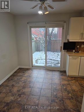 Oakville (Cv Clearview) apartment for rent - A room with a sliding glass door leading to a backyard.