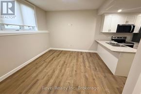 Woodstock (Woodstock - North) apartment for rent - A kitchen area with wooden flooring and white walls.