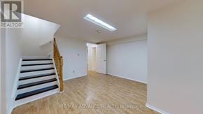 Toronto (Agincourt South-Malvern West) apartment for rent - A room with a staircase and a door.