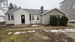 Richmond Hill apartment for rent - A house with a snow-covered ground and a chimney.