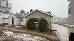 Richmond Hill apartment for rent - A house with a black door and a sign that says REALTOR.