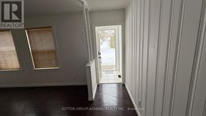Richmond Hill apartment for rent - A room with a doorway leading to a snowy landscape.
