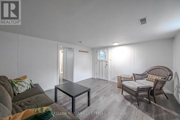 London North (North R) duplex for rent - A living room with a grey couch and a glass coffee table.
