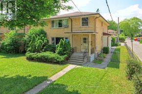 London North (North R) duplex for rent - A house with a front yard and a tree in the front.