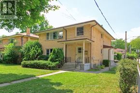 London North (North R) duplex for rent - A house with a green lawn in front.