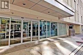 Toronto (Church-Yonge Corridor) condo for rent - A realtor office is located in a building with the number 210 on it.