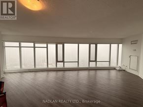 Toronto (Church-Yonge Corridor) condo for rent - A room with a large window and wooden flooring.