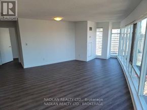 Toronto (Church-Yonge Corridor) condo for rent - A room with wooden flooring and a large window with blinds.