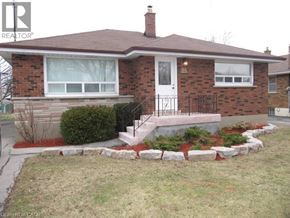 Hamilton apartment for rent - A house with a brick facade and a white door.