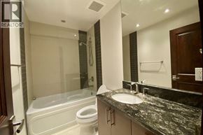 Vancouver apartment for rent - A bathroom with a sink, toilet, and bathtub.