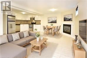Hamilton (Huntington) apartment for rent - A living room with a grey couch and a wooden coffee table.