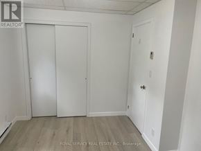 Cobourg multi-family for rent - A white door is on the left and a white door with a handle is on the right.
