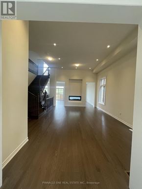 Oshawa (Kedron) apartment for rent - A realtor logo is on a picture of a house.