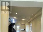 Oshawa (Kedron) apartment for rent - A hallway with a sign that says REALTOR.