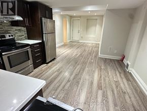 Richmond Hill (Harding) apartment for rent - A kitchen with wooden flooring and a white counter top.