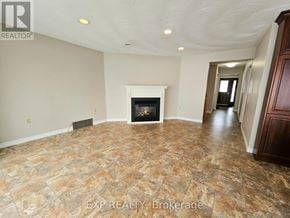 Deseronto (Deseronto (Town)) apartment for rent - A room with a fireplace and tile flooring.