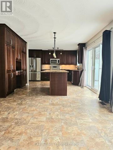 Deseronto (Deseronto (Town)) apartment for rent - A kitchen with brown cabinets and a tiled floor.